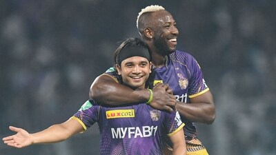 Kolkata Knight Riders' Suyash Sharma (L) celebrates with Andre Russell after taking the wicket of Royal Challengers Bangalore's Karn Sharma (AFP) Kolkata Knight Riders' Suyash Sharma (L) celebrates with Andre Russell after taking the wicket of Royal Challengers Bangalore's Karn Sharma (AFP)