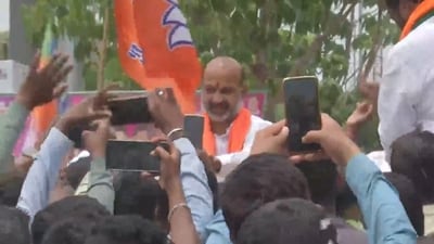 Telangana BJP chief Bandi Sanjay holds roadshow after release from Karimnagar district jail Friday morning on bail in the SSC paper leak case. (ANI) Telangana BJP chief Bandi Sanjay holds roadshow after release from Karimnagar district jail Friday morning on bail in the SSC paper leak case. (ANI)