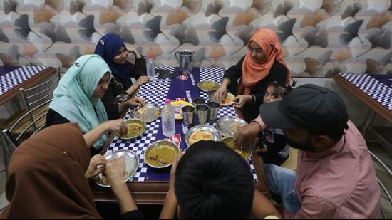 A family having Sehri at a food joint in Old City (HT Photo)