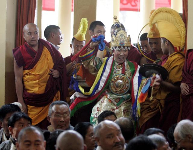 The Nechung oracle dances as she arrives at a prayer hall in Mcleodgunj on March 9, 2009. (Fayaz Kabli/REUTERS) The Nechung oracle dances as she arrives at a prayer hall in Mcleodgunj on March 9, 2009. (Fayaz Kabli/REUTERS)