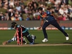 Sri Lanka's Kasun Rajitha (R) attempts to run out New Zealand's Mark Chapman (L) during the third Twenty20 cricket match between New Zealand and Sri Lanka at John Davies Oval in Queenstown on April 8, 2023. (Photo by Marty MELVILLE / AFP)