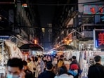 People visit a street market in Wuhan, China.