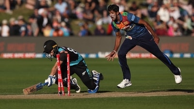 Sri Lanka's Kasun Rajitha (R) attempts to run out New Zealand's Mark Chapman (L) during the third Twenty20 cricket match between New Zealand and Sri Lanka at John Davies Oval in Queenstown on April 8, 2023. (Photo by Marty MELVILLE / AFP) (AFP) Sri Lanka's Kasun Rajitha (R) attempts to run out New Zealand's Mark Chapman (L) during the third Twenty20 cricket match between New Zealand and Sri Lanka at John Davies Oval in Queenstown on April 8, 2023. (Photo by Marty MELVILLE / AFP) (AFP)