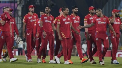 Punjab Kings' captain Shikhar Dhawan, second left, with his team walks back to pavilion after wining against Rajasthan Royals (AP) Punjab Kings' captain Shikhar Dhawan, second left, with his team walks back to pavilion after wining against Rajasthan Royals (AP)
