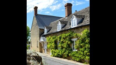 Just the sort of lovely home in a quiet English village that turns up as the scene of a violent crime in Agatha Christie’s cosy mysteries. (Shutterstock)