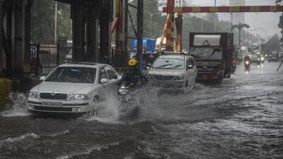 Mumbai, India - July 13, 2022: Vehicles wade through waterlogged street after heavy rain at Gandhi Market, Sion, in Mumbai, India, on Wednesday, July 13, 2022. (Photo by Pratik Chorge/Hindustan Times) (Pratik Chorge/HT PHOTO) Mumbai, India - July 13, 2022: Vehicles wade through waterlogged street after heavy rain at Gandhi Market, Sion, in Mumbai, India, on Wednesday, July 13, 2022. (Photo by Pratik Chorge/Hindustan Times) (Pratik Chorge/HT PHOTO)