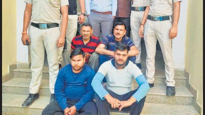 Satyapal Singh, 56, Majok Kumar, 44, Deepu, 31, and Vipin Sharma, 25 -- all seated -- in police custody. They were nabbed after police personnel from Shastri Park police station noticed passengers of an RTV vehicle screaming for help. (Photo/Delhi Police) Satyapal Singh, 56, Majok Kumar, 44, Deepu, 31, and Vipin Sharma, 25 -- all seated -- in police custody. They were nabbed after police personnel from Shastri Park police station noticed passengers of an RTV vehicle screaming for help. (Photo/Delhi Police)