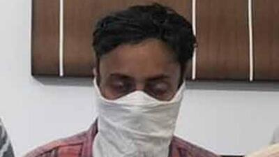 The accused carpenter, a resident of Ludhiana’s Kotala village, in police custody. (HT Photo)