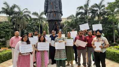 The faculty members of Dr Ram Manohar Lohiya National Law University, Lucknow, during their protest on April 8. (Sourced)