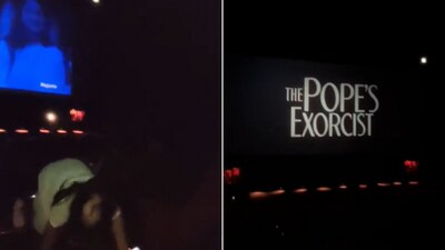 The image shows the woman scaring people in a theatre with The Pope's Exorcist trailer playing on the screen. (Twitter/@swatic12) The image shows the woman scaring people in a theatre with The Pope's Exorcist trailer playing on the screen. (Twitter/@swatic12)