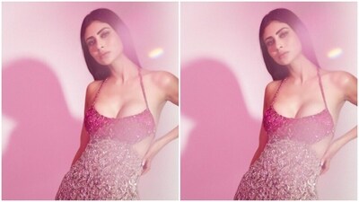 Mouni looked every bit gorgeous in the slip gown featuring halter neck details with a plunging neckline. The gown featured red embellishments and sequin details on the torso and cascaded down to silver details in bodycon patterns. (Instagram/@imouniroy) Mouni looked every bit gorgeous in the slip gown featuring halter neck details with a plunging neckline. The gown featured red embellishments and sequin details on the torso and cascaded down to silver details in bodycon patterns. (Instagram/@imouniroy)