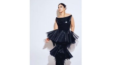 The dress perfectly hugged her curves in all the right places, accentuating her natural beauty. The addition of the delicate netted frills added the perfect amount of drama and flair to her outfit, making her stand out even more. (Instagram/@bhumipednekar) The dress perfectly hugged her curves in all the right places, accentuating her natural beauty. The addition of the delicate netted frills added the perfect amount of drama and flair to her outfit, making her stand out even more. (Instagram/@bhumipednekar)