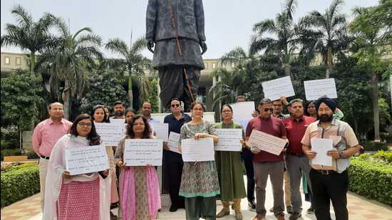 The faculty members of Dr Ram Manohar Lohiya National Law University, Lucknow, during their protest on April 8. (Sourced)