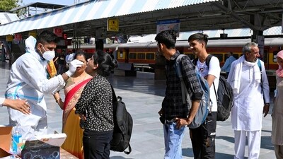 A healthcare worker collects a nasal swab sample of a passenger for COVID-19 testing amid a recent surge in the Coronavirus case, at the Railway Station, in Bikaner on Wednesday. (ANI/Used only for representation)