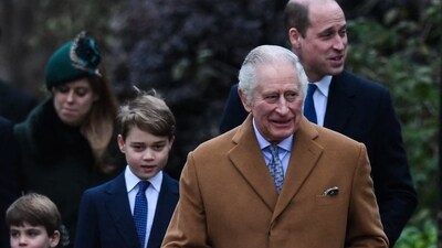 King Charles: Britain's Prince Louis of Wales (L), Britain's Prince George of Wales (C) and Britain's Prince William, Prince of Wales (rear R) walk behind Britain's King Charles III. (AFP)