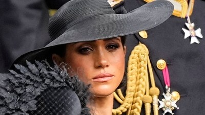 Meghan Markle: Meghan, Duchess of Sussex watches as the coffin of Queen Elizabeth II is placed into the hearse. (AP) Meghan Markle: Meghan, Duchess of Sussex watches as the coffin of Queen Elizabeth II is placed into the hearse. (AP)