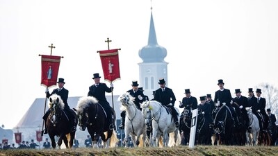 Sorb horsemen dressed in a black traditional outfit ride horses in the Sorbian Easter horseback procession on Easter Sunday in Ralbitz, eastern Germany. (AFP)