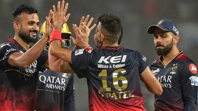 RCB players celebrate the dismissal of KKR batter Rahmanullah Gurbaz (PTI) RCB players celebrate the dismissal of KKR batter Rahmanullah Gurbaz (PTI)