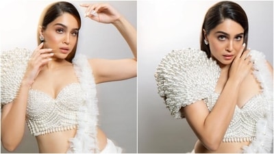 Sharvari wore an ivory-coloured pre-draped saree featuring ruffled embellishments and pearl embellishments. She styled it with a unique blouse that comes with a structured design on the shoulder, pearl embellishments, a sweetheart neckline, and a fitted bust.&nbsp; (Instagram )