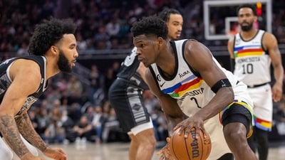 Minnesota Timberwolves guard Anthony Edwards (1) looks to drive past San Antonio Spurs forward Julian Champagnie, left, during the first half of an NBA basketball game, Saturday, April 8, 2023, in Austin, Texas. (AP) Minnesota Timberwolves guard Anthony Edwards (1) looks to drive past San Antonio Spurs forward Julian Champagnie, left, during the first half of an NBA basketball game, Saturday, April 8, 2023, in Austin, Texas. (AP)