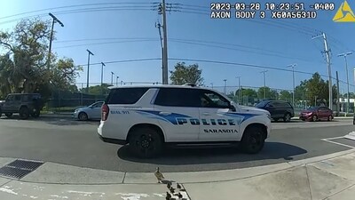 The image, taken from the video, shows a cop guiding ducks to safety. (Facebook/Sarasota Police Department) The image, taken from the video, shows a cop guiding ducks to safety. (Facebook/Sarasota Police Department)