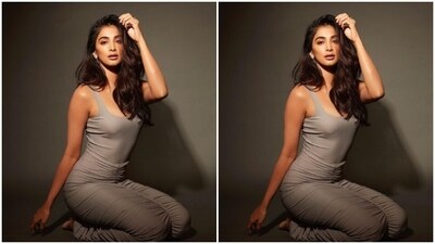 The sleeveless grey dress hugged Pooja's shape and showed off her curves perfectly. The dress came with a plunging neckline and ruched details below the waist. In sleek silver earrings from Karishma Joolry, Pooja accessorised her look for the day. (Instagram/@hegdepooja) The sleeveless grey dress hugged Pooja's shape and showed off her curves perfectly. The dress came with a plunging neckline and ruched details below the waist. In sleek silver earrings from Karishma Joolry, Pooja accessorised her look for the day. (Instagram/@hegdepooja)