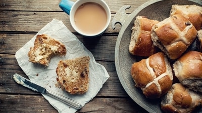 Hot Cross Buns (UK): These sweet, spiced buns are traditionally eaten on Good Friday, and are marked with a cross on the top to represent the crucifixion. (Unsplash) Hot Cross Buns (UK): These sweet, spiced buns are traditionally eaten on Good Friday, and are marked with a cross on the top to represent the crucifixion. (Unsplash)