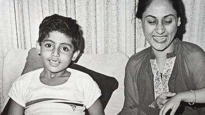 Jaya Bachchan and a young Abhishek having a good time together. Jaya Bachchan and a young Abhishek having a good time together.
