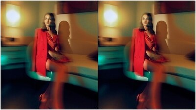 Shehnaaz decked up in a slip red satin dress and teamed it with a red blazer with lapel collars and full sleeves and aced the look.&nbsp; (Instagram/@shehnaazgill)