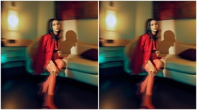 With a glittery red sling clutch, Shehnaaz posed like a diva for the indoor photoshoot.&nbsp; (Instagram/@shehnaazgill)