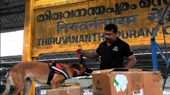 Thiruvananthapuram: A policeman with a sniffer dog carries out checking at the Central Railway Station in light of the arson attack inside a train near Kozhikode a few days back, in Thiruvananthapuram. (PTI)
