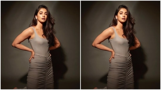 Styled by fashion stylist Mohit Rai, Pooja wore her tresses open in wavy curls with a side part and decked up in nude eyeshadow, mascara-laden eyelashes, contoured cheeks and a shade of nude lipstick.&nbsp;(Instagram/@hegdepooja)