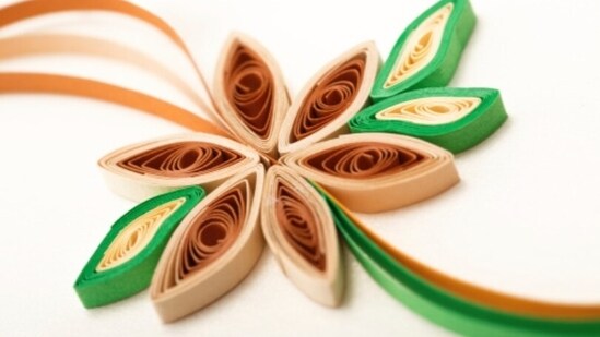 Develop your design skills: To create intricate and beautiful designs with paper quilling, you need to have strong design skills. This includes understanding color theory, composition, and balance. Practice designing your own patterns and experimenting with different color combinations to hone your skills.(Unsplash)
