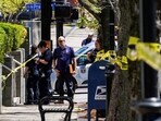 Police deploy at the scene of a mass shooting outside an Old National Bank branch near Slugger Field baseball stadium in downtown Louisville, Kentucky, U.S. April, 10, 2023.