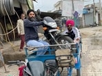 In another picture, Amritpal Singh and Papalpreet Singh can be seen sitting on a three-wheeler along with a bike.