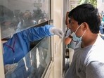 A healthcare worker takes a swab sample of a man during a mock drill to check COVID-19 preparedness amid rising cases of coronavirus, at RML Hospital, in New Delhi, Monday. A healthcare worker takes a swab sample of a man during a mock drill to check COVID-19 preparedness amid rising cases of coronavirus, at RML Hospital, in New Delhi, Monday.