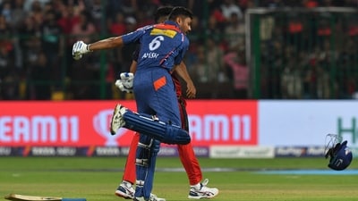 Avesh Khan celebrates after winning the IPL match against Royal Challengers Bangalore at the M Chinnaswamy Stadium in Bengaluru (AFP)