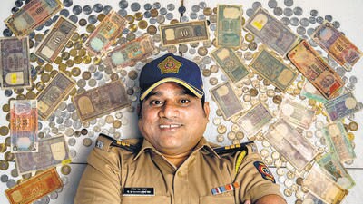 Mumbai, India - April 10, 2023: Police personnel Umesh Kadav displays his collection of post-independent coins and paper currencies of India at his residence, in Worli, Mumbai, India, on Monday, April 10, 2023. (Photo by Anshuman Poyrekar/ Hindustan Times) (Anshuman Poyrekar/HT PHOTO) Mumbai, India - April 10, 2023: Police personnel Umesh Kadav displays his collection of post-independent coins and paper currencies of India at his residence, in Worli, Mumbai, India, on Monday, April 10, 2023. (Photo by Anshuman Poyrekar/ Hindustan Times) (Anshuman Poyrekar/HT PHOTO)