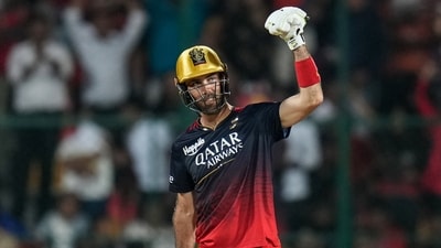 Royal Challengers Bangalore batter Glenn Maxwell celebrates after scoring a half-century during the IPL 2023 match against Lucknow Super Giants (PTI)