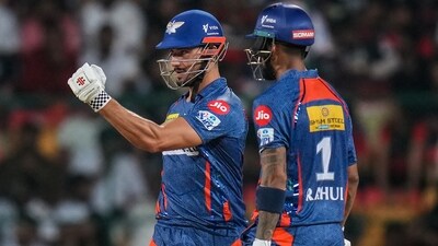 Marcus Stoinis celebrates after scoring a half-century during the IPL 2023 match against Royal Challengers Bangalore (PTI)