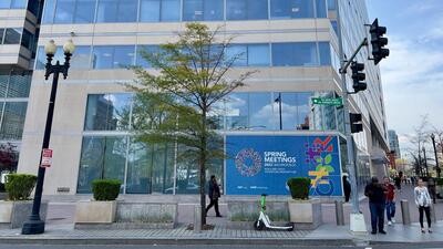 People walk past a sign for the 2023 Spring Meetings of the World Bank/International Monetary Fund on the IMF building in Washington, DC. The Spring meetings will take place in person from April 10 to 16. (AFP) People walk past a sign for the 2023 Spring Meetings of the World Bank/International Monetary Fund on the IMF building in Washington, DC. The Spring meetings will take place in person from April 10 to 16. (AFP)