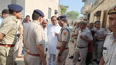 Police officials at Sandal Kalan village in Sonepat on Monday.