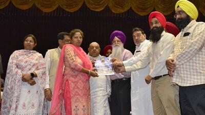 Punjab local bodies minister Inderbir Singh Nijjar (fourth from right) handing over allotment letter to an applicant in Ludhiana on Monday. (Manish Kalia/HT) Punjab local bodies minister Inderbir Singh Nijjar (fourth from right) handing over allotment letter to an applicant in Ludhiana on Monday. (Manish Kalia/HT)