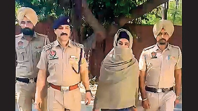 Radical preacher Amritpal Singh's close aide Papalpreet Singh in police custody on Monday. (PTI) Radical preacher Amritpal Singh's close aide Papalpreet Singh in police custody on Monday. (PTI)