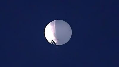 The huge, high-altitude Chinese balloon sailed across the US, drawing severe Pentagon accusations of spying and sending excited or alarmed Americans outside with binoculars. (AP) The huge, high-altitude Chinese balloon sailed across the US, drawing severe Pentagon accusations of spying and sending excited or alarmed Americans outside with binoculars. (AP)