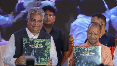 Uttar Pradesh chief minister Yogi Adityanath with Union minister Bhupender Yadav releases a booklet on ‘Heritage trees of Uttar Pradesh’ during a two-day National Climate Conclave, in Lucknow on Monday. (PTI PHOTO) Uttar Pradesh chief minister Yogi Adityanath with Union minister Bhupender Yadav releases a booklet on ‘Heritage trees of Uttar Pradesh’ during a two-day National Climate Conclave, in Lucknow on Monday. (PTI PHOTO)