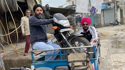 In another picture, Amritpal Singh and Papalpreet Singh can be seen sitting on a three-wheeler along with a bike. In another picture, Amritpal Singh and Papalpreet Singh can be seen sitting on a three-wheeler along with a bike.