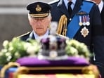 Britain's King Charles III walks behind the coffin of Queen Elizabeth II during a procession from Buckingham Palace to the Palace of Westminster, in London on September 14. Britain's King Charles III walks behind the coffin of Queen Elizabeth II during a procession from Buckingham Palace to the Palace of Westminster, in London on September 14.