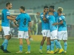 Mumbai City FC team celebrates after scoring a goal during match 74 of the Hero Indian Super League 2022