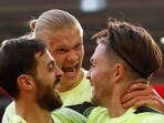 Manchester City's Jack Grealish celebrates scoring their second goal with Bernardo Silva and Erling Braut Haaland 